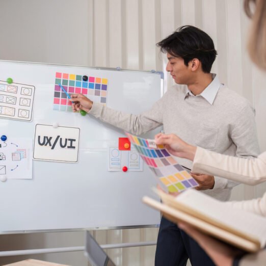 Creative designer team leader presentation on application design and ux ui usability planning. Modern business team teamwork..